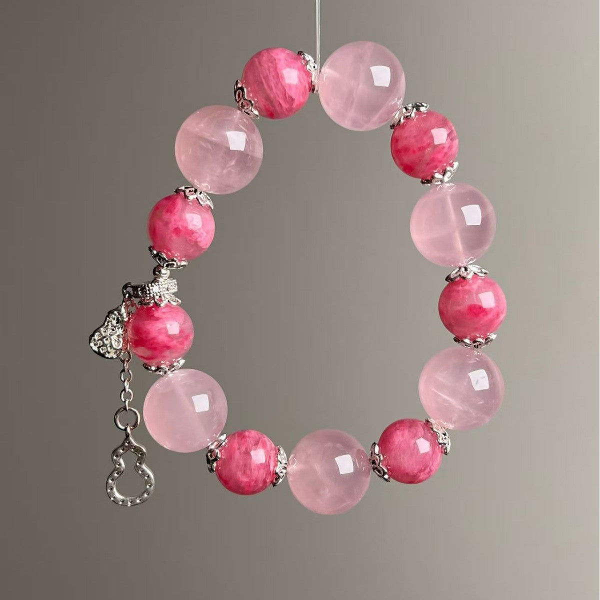 Natural rose quartz bracelet with pink 11-14mm beads and silver gourd charm