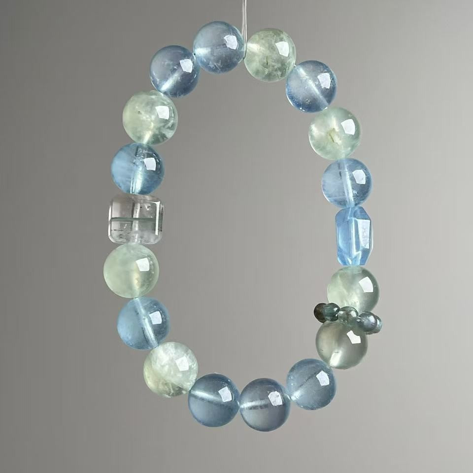 Natural aquamarine and clear quartz bracelet with 11mm icy-blue beads