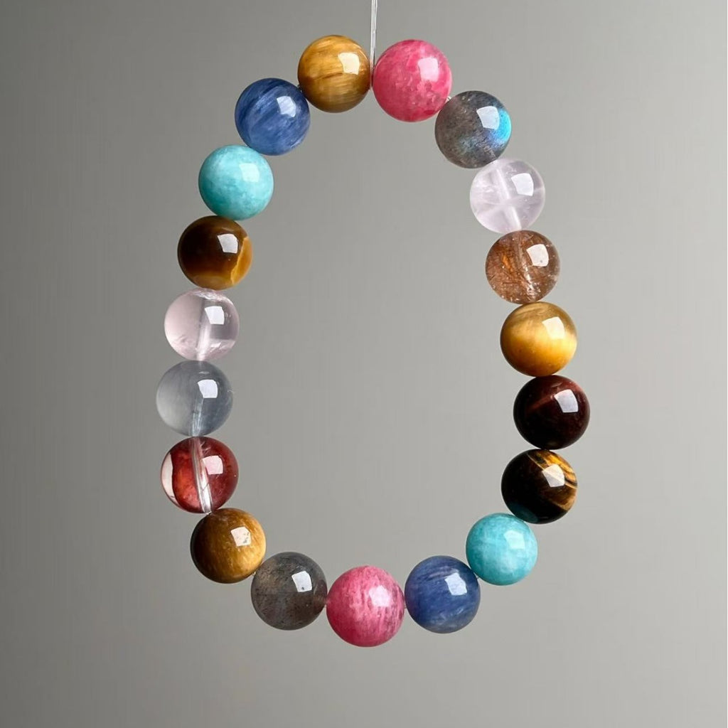 Natural mixed gemstone chakra bracelet with 11mm multi-colored crystal beads