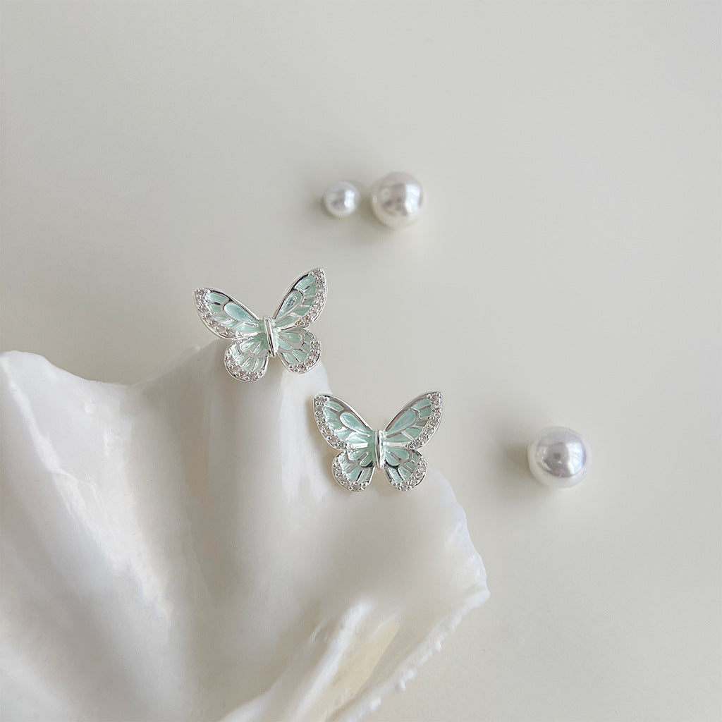 Mint green enamel butterfly stud earrings with white petal