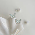Mint green enamel butterfly stud earrings with white petal