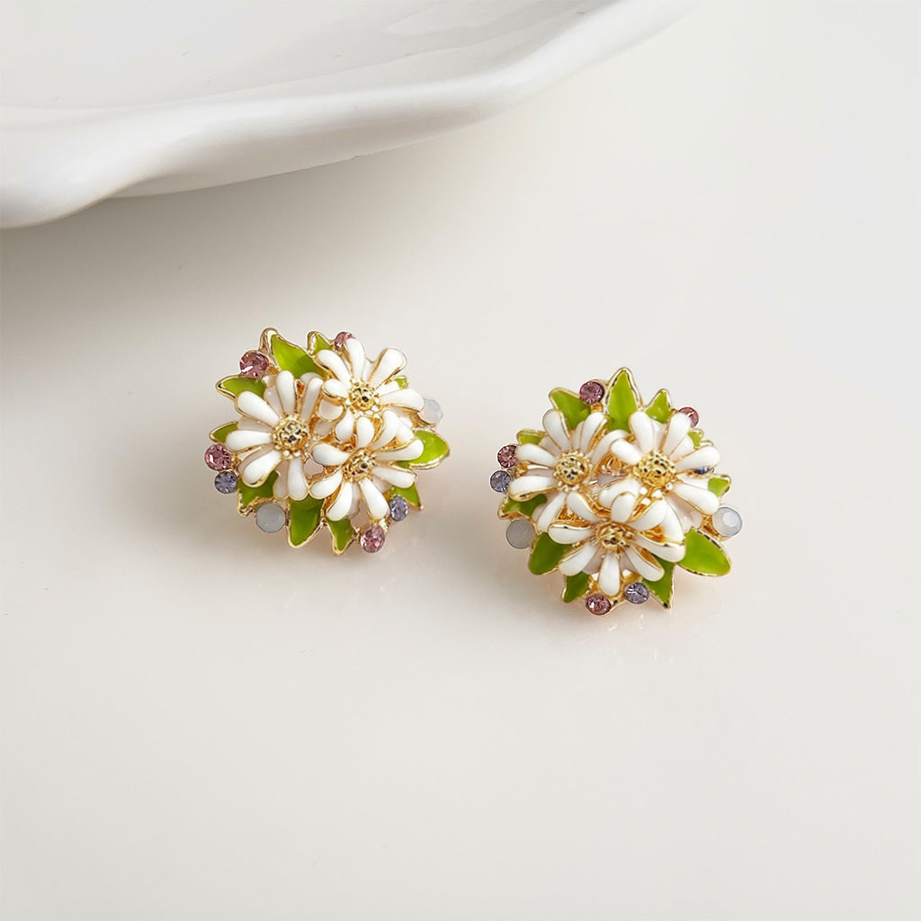 Model wearing white daisy cluster stud earring
