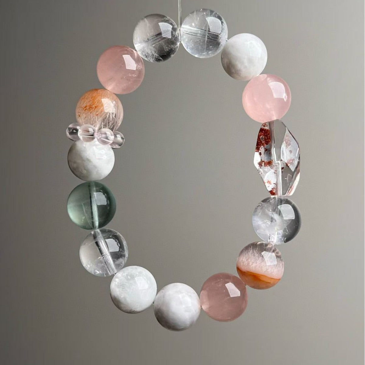 Pastel multi-gemstone bracelet featuring rose quartz, snow phantom and clear quartz beads