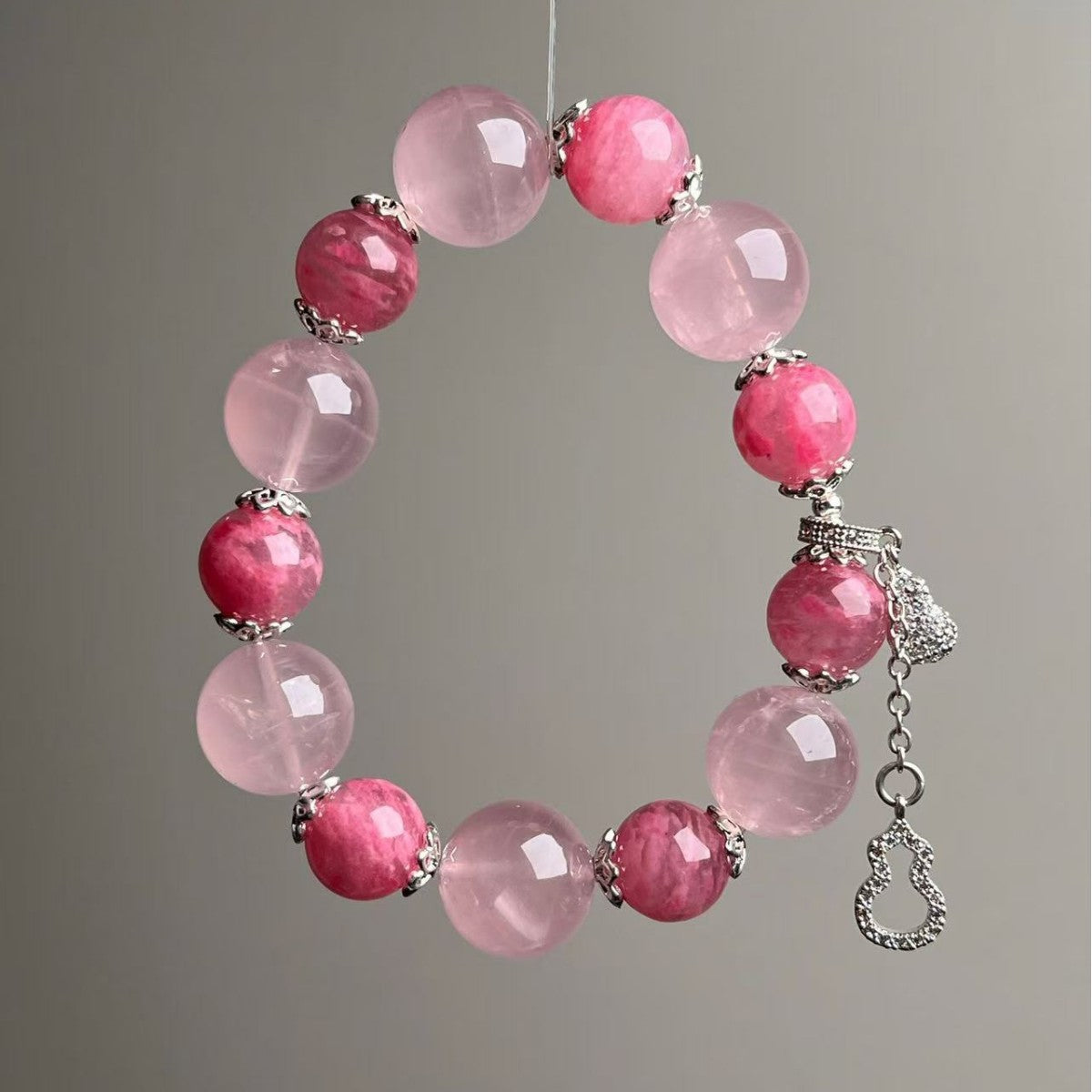 Rose quartz love crystal bracelet with soft pink beads and silver spacer caps