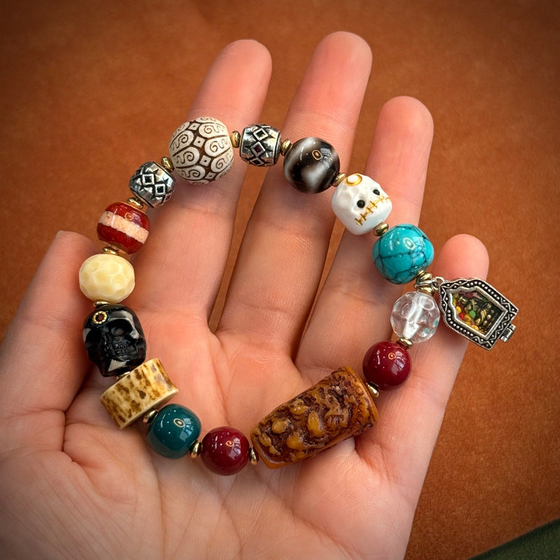 Colorful Tibetan multi-gem bracelet with skull bead and turquoise