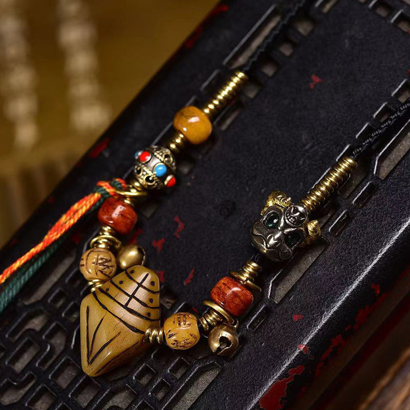 Hand woven ethnic beaded necklace with black braided cord and tassel