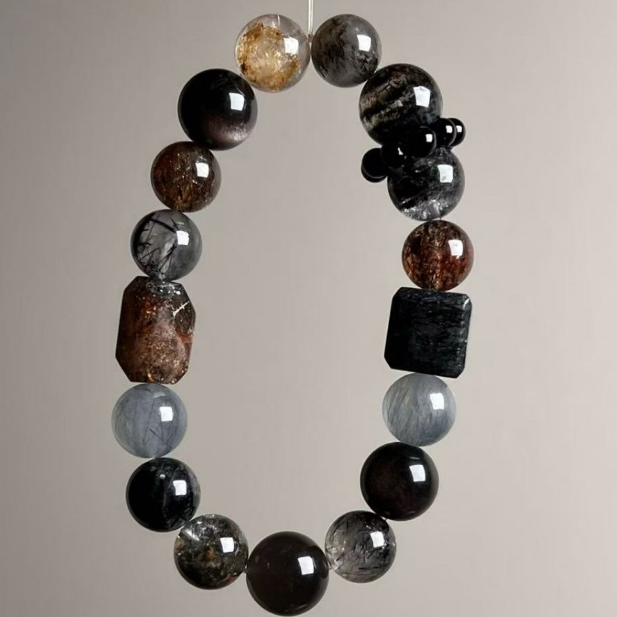 Dark-toned Super Seven crystal bracelet with smoky quartz, tourmaline and golden rutile beads