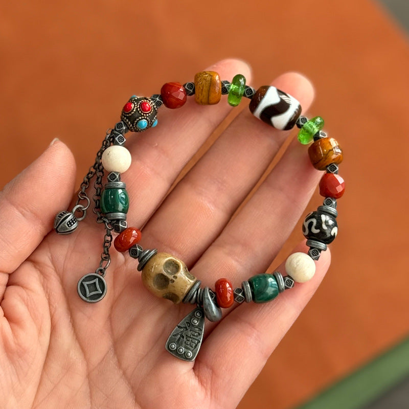 Colorful Tibetan multi-gem bracelet with skull focal bead and dzi bead
