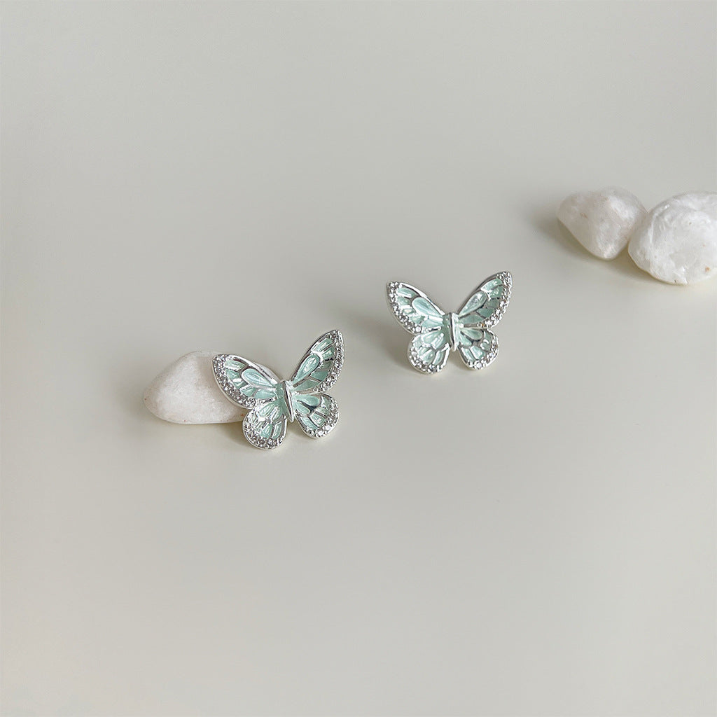 Pair of mint butterfly stud earrings with white stones