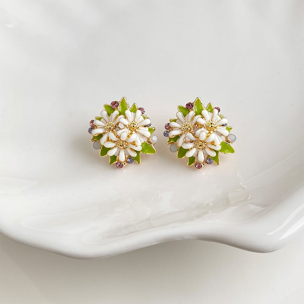 Hand painted daisy cluster earrings with green leaves and rhinestones