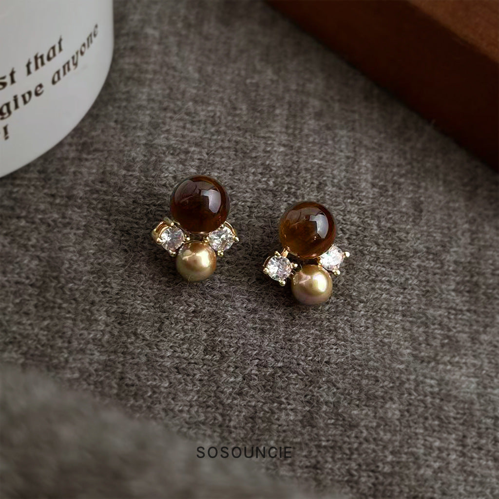 Brown tiger's eye pearl cluster earrings on linen