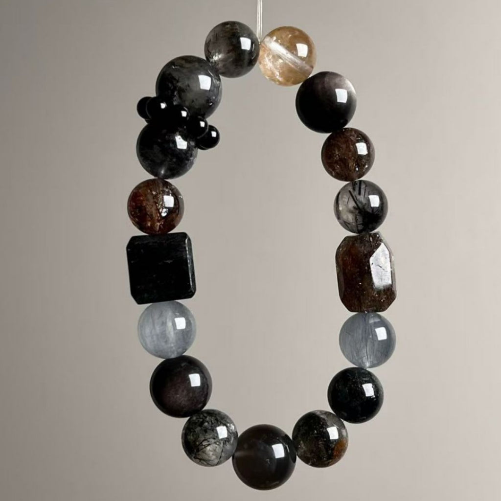 Mixed-shape protection crystal bracelet featuring black tourmaline cube and rutilated quartz