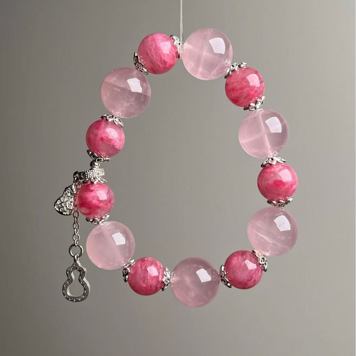 Close-up of natural rose quartz 11-14mm beads in romantic pink tones