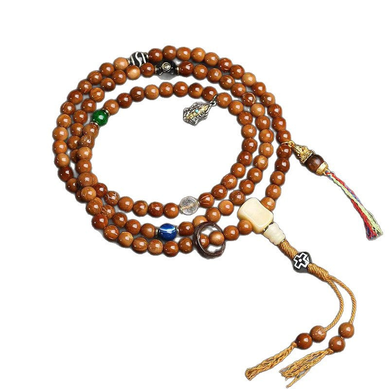 Cook seed 108 mala coiled on white background showing full length