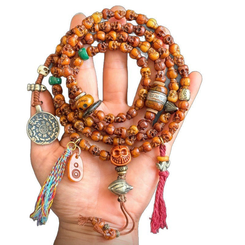 Full yak bone Citipati skull 108 mala on white background