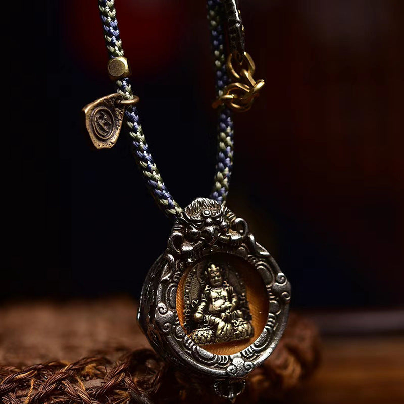 Antiqued brass Yellow Jambhala pendant close-up