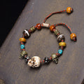 Caramel bone barrel Citipati bracelet with teal cord